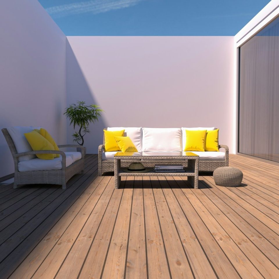 Sunny rooftop deck with contemporary outdoor seating