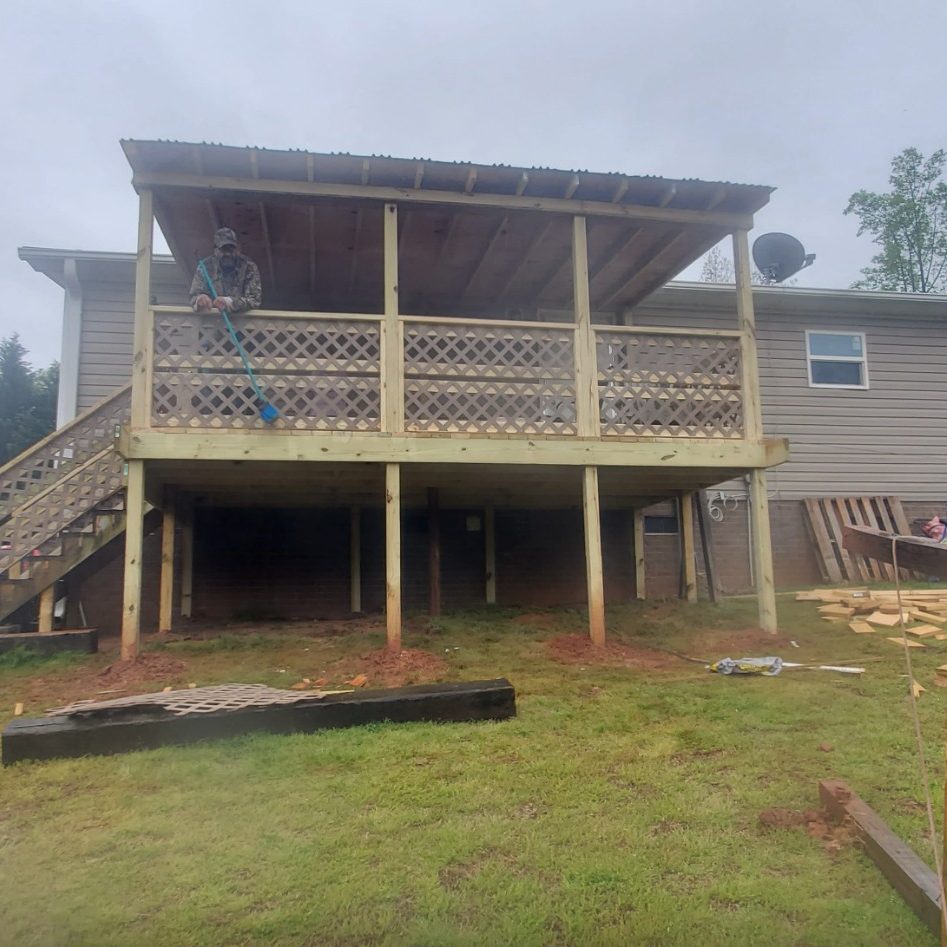 Newly constructed elevated wooden deck and covered porch on a residential home